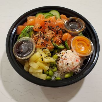Poki Cafe  - Rice, salmon, Yuzu ponzu, Sweet Eel, Spicy mayo sauce, Cucumber, Crab meat, Pineapple, Edamame, Avocado topped with seaweed sesame mix. - Poke Near Me - corona, California