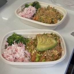 Two salmon Medium Poke Bowls with avocado