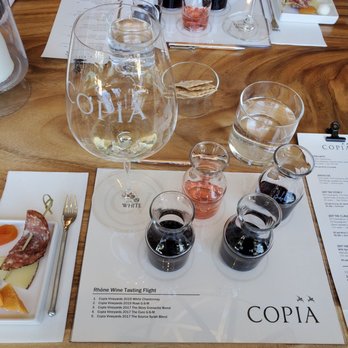 Copia Vineyards and Winery - The adorable tasting set up complete with bites of food to pair with the wine. An added treat to the wine reservation - Wine Tasting Room Near Me - Paso Robles, California Copia Vineyards and Winery - The adorable tasting set up complete with bites of food to pair with the wine. An added treat to the wine reservation - Wine Tasting Room Near Me - Paso Robles, California