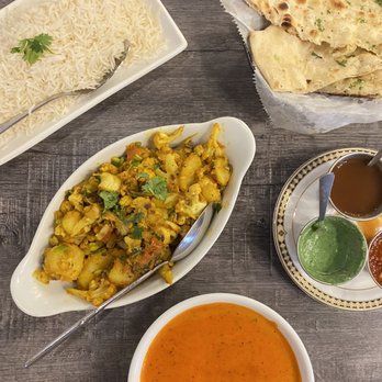 Tandoori Palace - Plain Basmati Rice, garlic naan, Alu gobi, and a side of tikka Masala sauce. - Indian Near Me - Encinitas, California Tandoori Palace - Plain Basmati Rice, garlic naan, Alu gobi, and a side of tikka Masala sauce. - Indian Near Me - Encinitas, California
