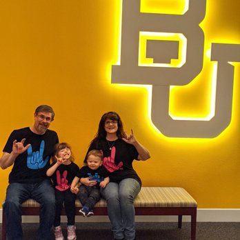Mayborn Museum - American sign language  "I love you" sign & family in front of Baylor U. Sign - Museums Near Me - Waco, Texas