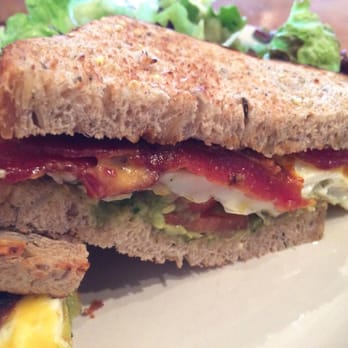 Commonwealth Cafe - Fried egg sandwich, guacamole, tomato, Pinconning cheddar, hot sauce, toasted multigrain, Suchman bacon, greens - Coffee & Tea Near Me - Birmingham, Michigan Commonwealth Cafe - Fried egg sandwich, guacamole, tomato, Pinconning cheddar, hot sauce, toasted multigrain, Suchman bacon, greens - Coffee & Tea Near Me - Birmingham, Michigan