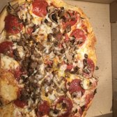 Photo of Razzo's Pizza and Salads - Oakland, CA, United States. The delivery guy literally handed me this sideways. All the pizza was smooshed into the corner.