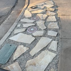 2" Sunset flagstone with pea gravel between on sidewalk strip.