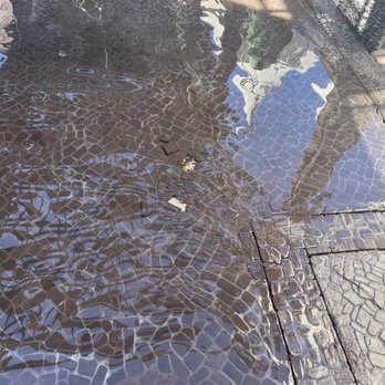 Eau Spa - Broken tiles sitting in plain sight. Dangerous. - Day Spas Near Me - Manalapan, Florida