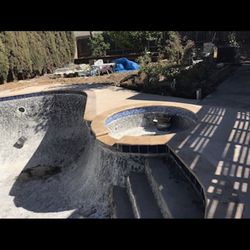 Aviles Pool and Backyard Remodeling - New cement and pool coping.