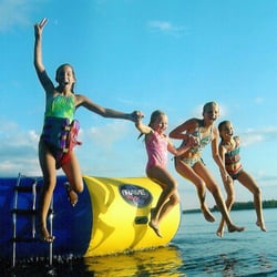 Resort guests enjoy the RAVE trampoline and waterfront activities