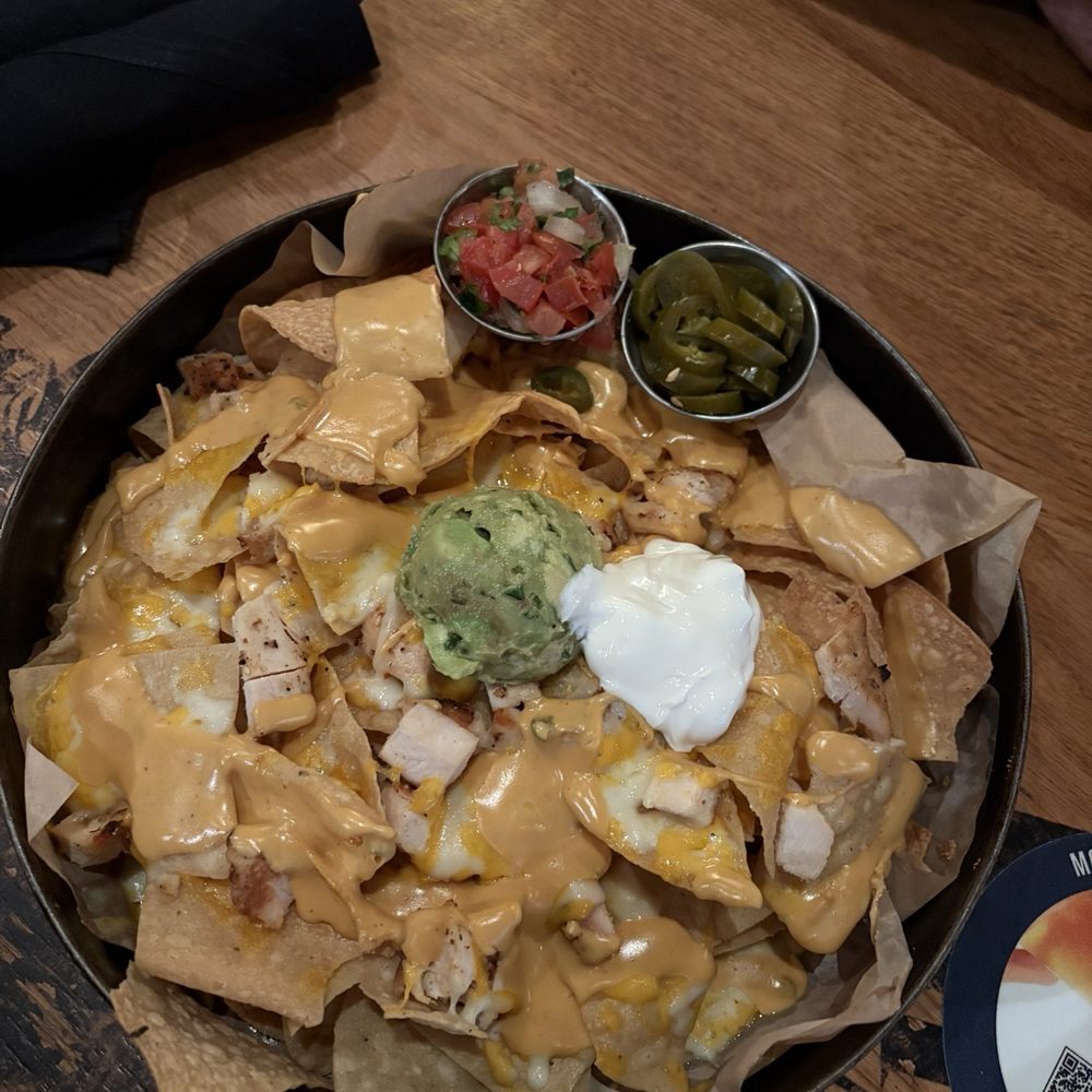 BJ's Restaurant & Brewhouse - Deep dish nachos - New American Near Me - Orlando, Florida BJ's Restaurant & Brewhouse - Deep dish nachos - New American Near Me - Orlando, Florida
