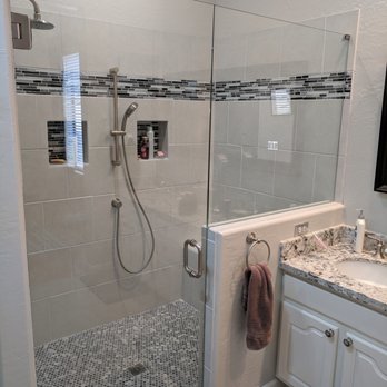 Relion Builders - a walk in shower with a glass door - General Contractors Near Me Relion Builders - a walk in shower with a glass door - General Contractors Near Me