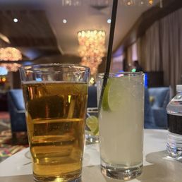 A blueberry drink and beer A blueberry drink and beer