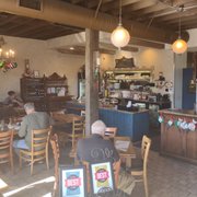 Photo of Olympic Cafe - San Diego, CA, United States. Partial view of the inside dining area and service counter