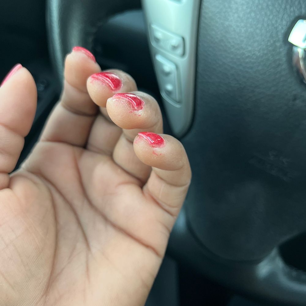 Paint under the nails that I was charges $5 to clean up and is still there. Paint under the nails that I was charges $5 to clean up and is still there.