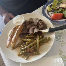 Gyro lunch plate with green beans and potatoes. Nice portions.