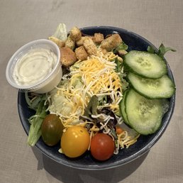 Side salad with ranch dressing.