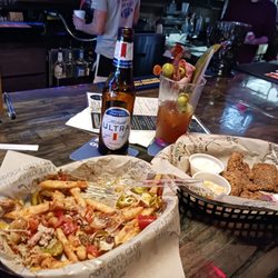 The Sand Trap Indoor Golf Club - Loaded French fries and fried Portobella shrooms which are . Bloody Mary with Ham,Bacon ,olives ,and a big Ole pickle strip....