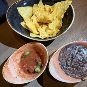 Caló Kitchen + Tequila - Curtesy fresh free chips salsa and bean. - Cocktail Bars Near Me - Costa Mesa, California Caló Kitchen + Tequila - Curtesy fresh free chips salsa and bean. - Cocktail Bars Near Me - Costa Mesa, California