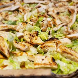 Grilled chicken caesar salad pizza