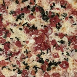 a pepperoni and spinach pizza a pepperoni and spinach pizza