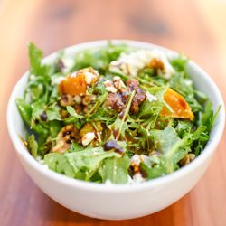 Inner Sanctum Cellars - Crisp Arugula, Creamy Goat Cheese, fresh Snap Peas, toasted Walnuts, dressed in a Roasted Garlic Vinaigrette
