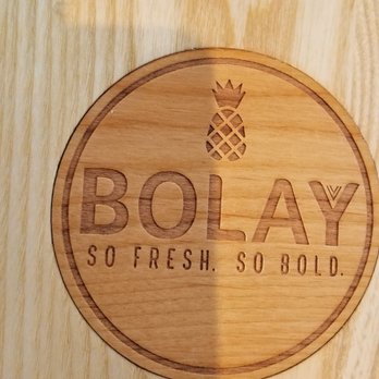 Bolay - Love the wooden tables with the inlay with the logo. - New American Near Me - Oviedo, Florida