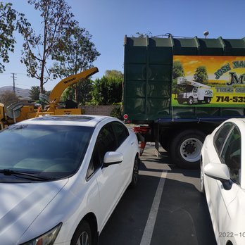 Jose Martinez Tree Service - a white car in a parking lot - Tree Services Near Me - Placentia, California Jose Martinez Tree Service - a white car in a parking lot - Tree Services Near Me - Placentia, California