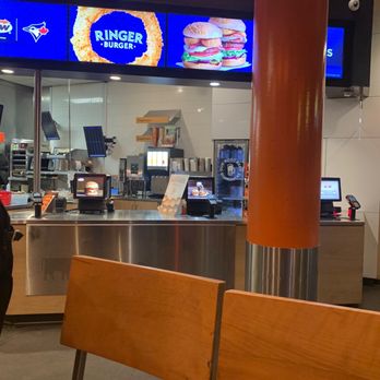 A&W - a man standing in front of a restaurant counter - Burgers Near Me - Vancouver, British Columbia A&W - a man standing in front of a restaurant counter - Burgers Near Me - Vancouver, British Columbia