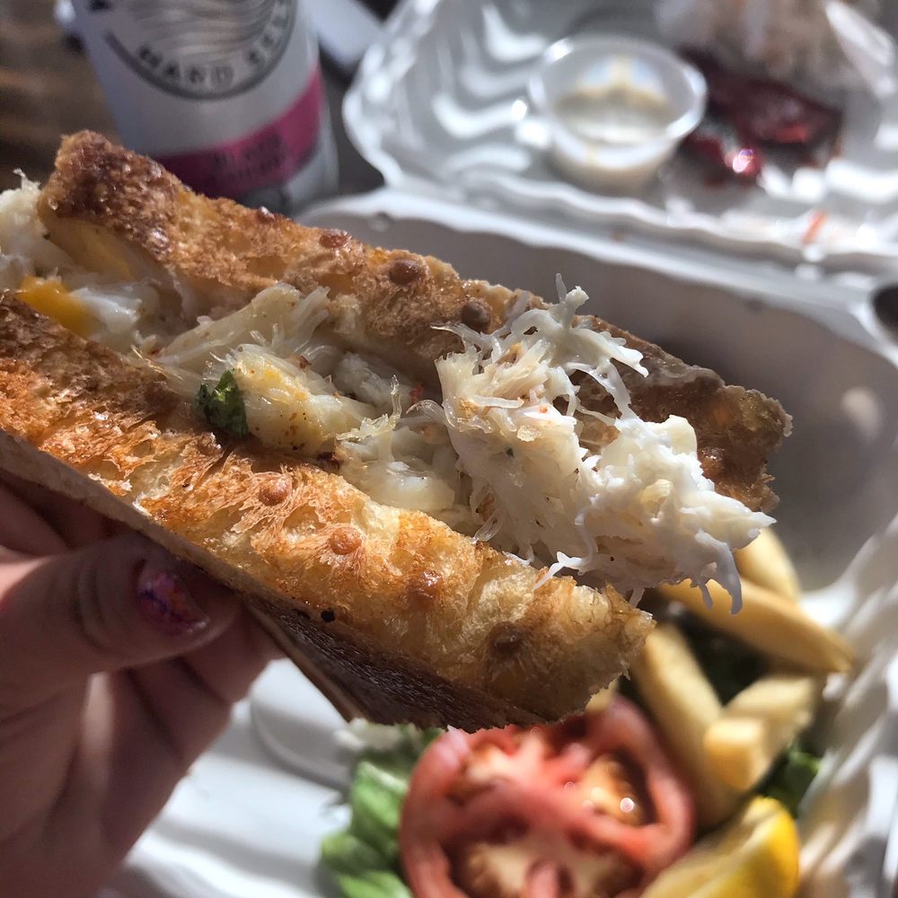Vallemar Station - a person holding a sandwich in their hand - Steakhouses Near Me - Pacifica, California Vallemar Station - a person holding a sandwich in their hand - Steakhouses Near Me - Pacifica, California