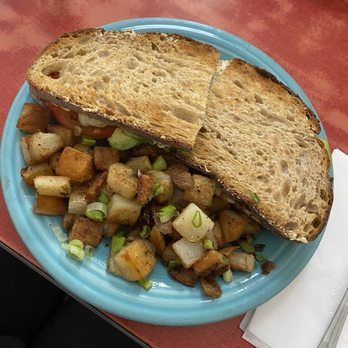 Mama's Royal Cafe - Grilled chicken sandwich with avocado, tomato, and Mayo with a side of potatoes. Really large sandwich, enough for 2 meals. - Breakfast & Brunch Near Me - Oakland, California
