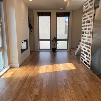 Repairs Unlimited - an empty living room with hardwood floors - General Contractors Near Me - Northglenn, Colorado Repairs Unlimited - an empty living room with hardwood floors - General Contractors Near Me - Northglenn, Colorado