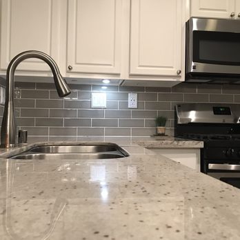 Luxury Stone - a kitchen with stainless steel appliances - Flooring Near Me - Hesperia, California