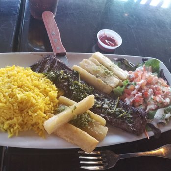 Sofrito Latin Cafe - Chimichurri steak with fried yucca and yellow rice and salad - Latin American Near Me - Orlando, Florida Sofrito Latin Cafe - Chimichurri steak with fried yucca and yellow rice and salad - Latin American Near Me - Orlando, Florida
