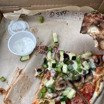 MOD Pizza - a half eaten pizza in a box - Fast Food Near Me - Fort Worth, Texas