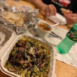 D'Aurelios - Pesto pasta (my one and only dish every time I come to Fort Bragg) and combo pizza in the background. Delicious.