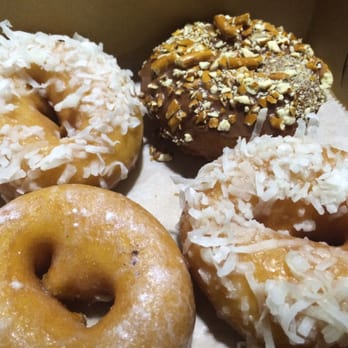 Sandy Pony Donuts - Sea Foam, Chocolate Covered Pretzel, Cow Tail, & Banana Coconut (left to right, top to bottom) - Donuts Near Me - Annapolis, Maryland Sandy Pony Donuts - Sea Foam, Chocolate Covered Pretzel, Cow Tail, & Banana Coconut (left to right, top to bottom) - Donuts Near Me - Annapolis, Maryland