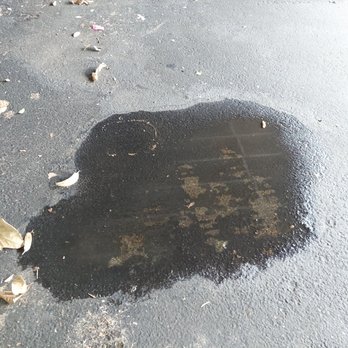 Jiffy Lube - Puddle of fluid under my car in the garage port from a leak after I had my oil changed with Jiffy Lube - Oil Change Stations Near Me - Honolulu, Hawaii