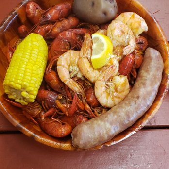 Crawfish Hideaway - a plate of food on a table - Cajun/Creole Near Me - Baytown, Texas