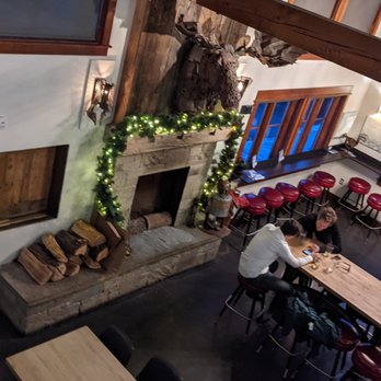 MAP Brewing Co - Fireplace with a moosehead - Breweries Near Me - Bozeman, Montana MAP Brewing Co - Fireplace with a moosehead - Breweries Near Me - Bozeman, Montana