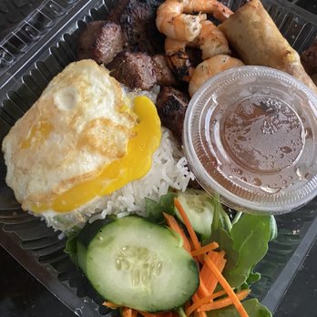 Viet Pho Restaurant - C3. Grill Prawns, Pork Chop & Eggrolls Over Fried Egg Plate even comes with large cup of broth soup on the side. - Noodles Near Me - Vallejo, California