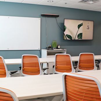 Office Evolution Hillsboro - Meeting room that seats 12, with a video bar to enhance your virtual guest experience. Ideal for team meetings and training presentations. - Shared Office Spaces Near Me - Hillsboro, Oregon Office Evolution Hillsboro - Meeting room that seats 12, with a video bar to enhance your virtual guest experience. Ideal for team meetings and training presentations. - Shared Office Spaces Near Me - Hillsboro, Oregon