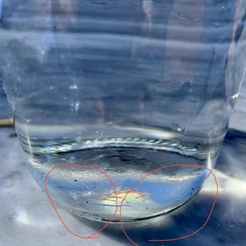 Slanted Door - A few black bits in the bottom of the water bottle. - Vietnamese Near Me - San Ramon, California