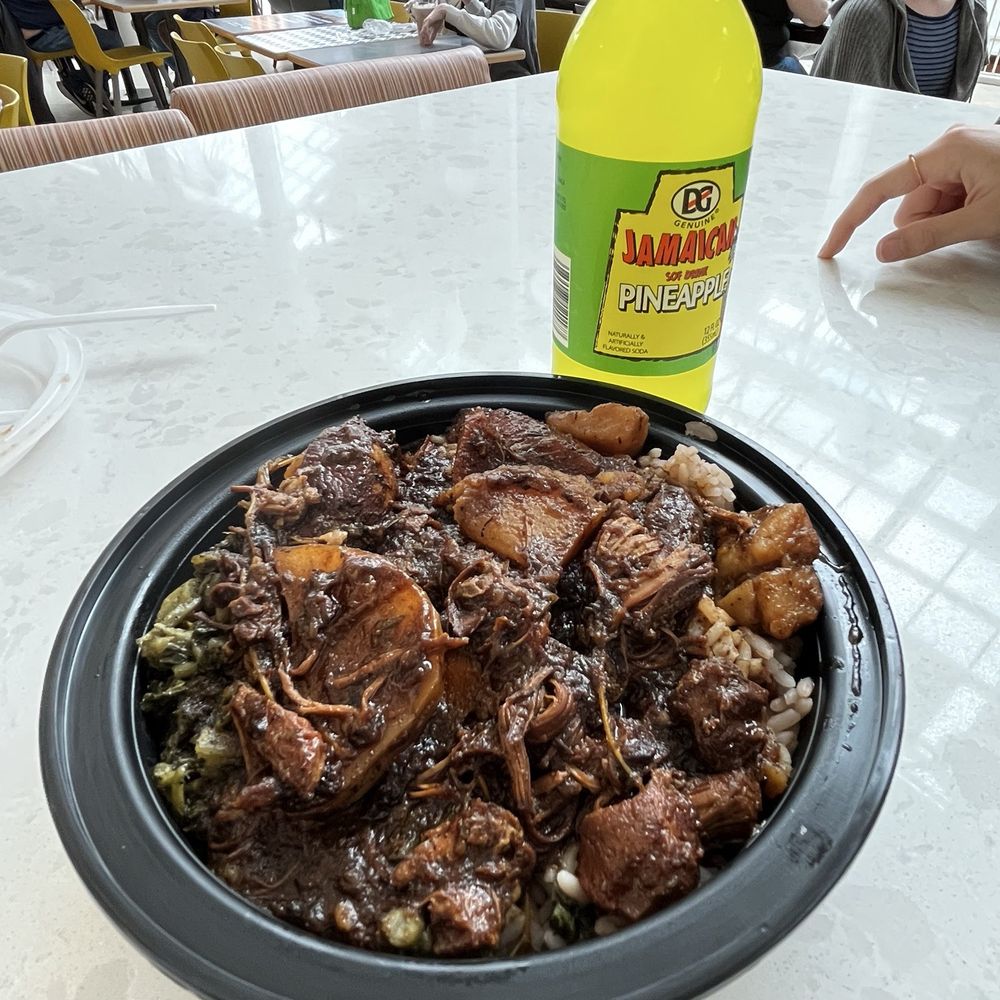 Stew chicken with rice n beans and some kind of collard greens. Stew chicken with rice n beans and some kind of collard greens.