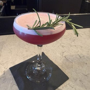 Corinne at The Domain - Highland Bloom - Still Austin Bourbon, Blueberry Rosemary Syrup, lemon. - Bars Near Me - Austin, Texas