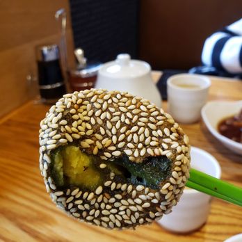 Tim Ho Wan - Hell's Kitchen - Green tea sesame ball with custard. - Dim Sum Near Me - New York, New York Tim Ho Wan - Hell's Kitchen - Green tea sesame ball with custard. - Dim Sum Near Me - New York, New York