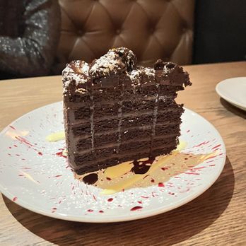 The Americano - a slice of chocolate cake on a plate - Seafood Near Me - Stamford, Connecticut The Americano - a slice of chocolate cake on a plate - Seafood Near Me - Stamford, Connecticut