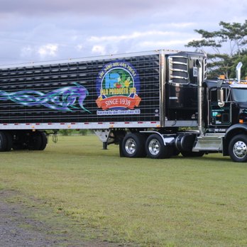 Hilo Products - a large semi truck parked in a field - Fruits & Veggies Near Me - Hilo, Hawaii