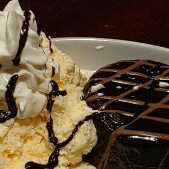 Murphy's Taproom & Carriage House - Dessert. Molten lava cake with vanilla ice cream. - American Near Me - Bedford, New Hampshire Murphy's Taproom & Carriage House - Dessert. Molten lava cake with vanilla ice cream. - American Near Me - Bedford, New Hampshire