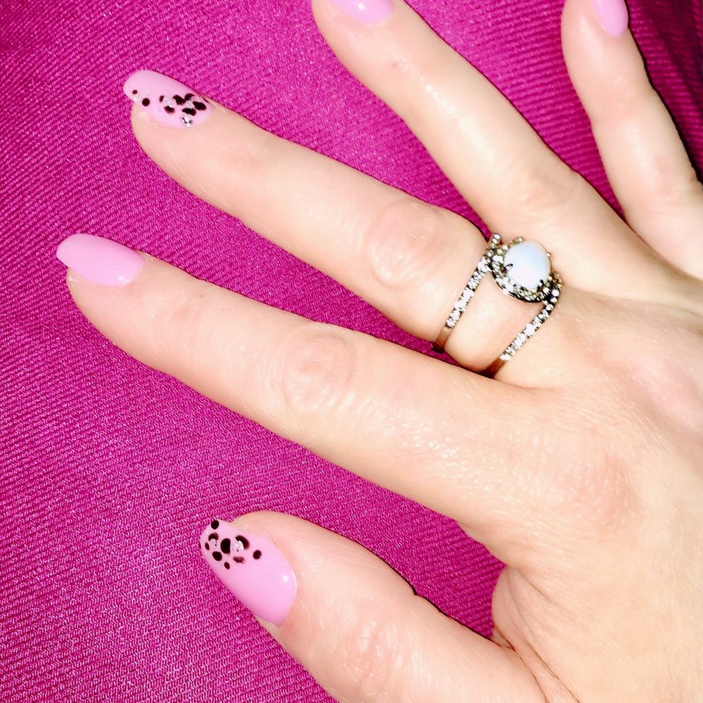 SNS on natural nails with leopard print on edges of some. SNS on natural nails with leopard print on edges of some.