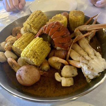 The Tangy Crab - Juicy Special Boil with additional corn and scallops. - Seafood Near Me - Lansing, Michigan The Tangy Crab - Juicy Special Boil with additional corn and scallops. - Seafood Near Me - Lansing, Michigan