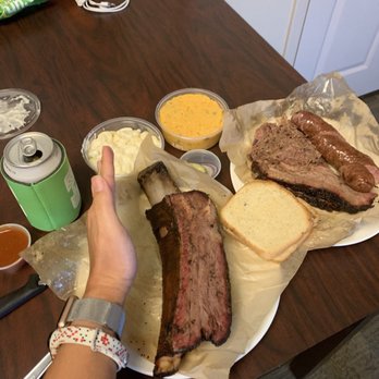 Micklethwait Craft Meats - I got the food to go, but here's the beef rib, and 3 meat platter: brisket, pulled lamb and bierwurst - Food Trucks Near Me - Austin, Texas