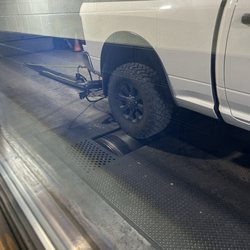 Buds Muffler - Truck getting inspected